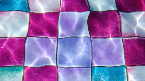 Video of swaying light waters in a spacious and luxury looking colorful swimm Stock Footage 105656340