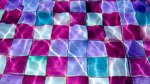 Video of swaying light waters in a spacious and luxury looking colorful swimm Stock Footage 108097253