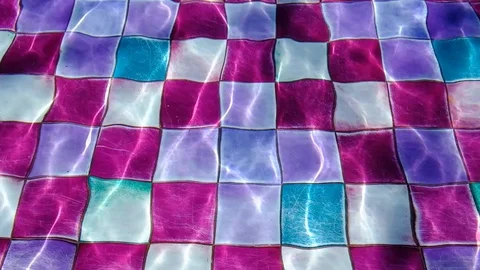Video of swaying light waters in a spacious and luxury looking colorful swimm Stock Footage 109545878