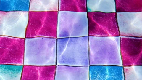 Video of swaying light waters in a spacious and luxury looking colorful swimm Stock Footage 109546006