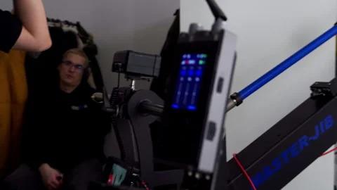 Video technician connects camera motion control system Stock Footage 303060755