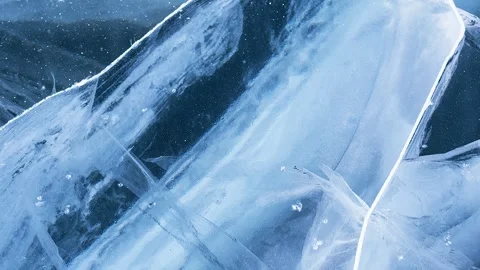 Video of texture of blue ice with cracks on frozen Baikal Lake in winter Stock Footage 305444089