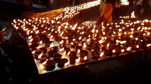 Video of thousands of clay diyas being lit by women during Hindu festival c.. Video stock 313381826