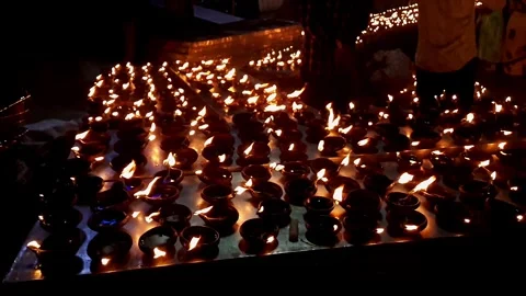 Video of thousands of clay diyas being lit by women during Hindu festival c.. Stock Footage 313381828
