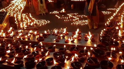 Video of thousands of clay diyas being lit by women during Hindu festival c.. Stock Footage 313381836