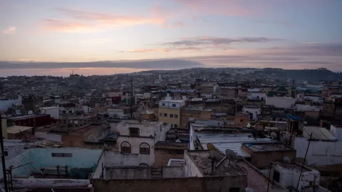 This video is a time-lapse shot from a high vantage point in the city of Fez Stock Footage 346434403