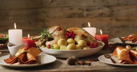 Video of tray with roasted turkey and diverse dishes on wooden surface 스톡 동영상 331306991
