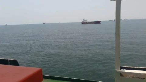 Video of a trip by ship in the middle of Indonesian waters in the morning Stock Footage 324351319