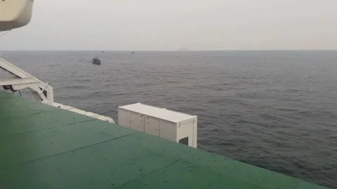 Video of a trip by ship in the middle of Indonesian waters in the morning Stock Footage 324351701