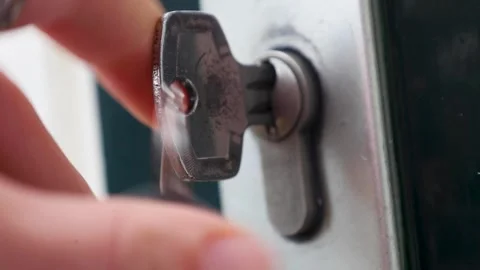 Video turning key around inside door lock. Stock Footage 341674868