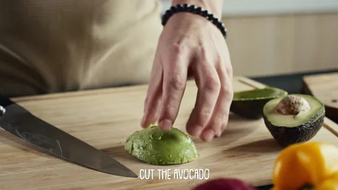 Video Tutorial of Cutting Ripe Avocado with Subtitles Stock Footage 262065378