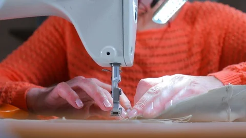 Video tutorial on sewing on a sewing machine at home. COVID 19 Stock Footage 128164798