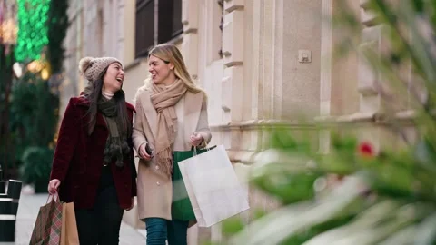 Video of two beautiful friends talking and having fun while walking on the .. Stock Footage 340825291