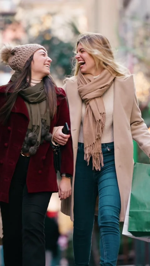 Video of two beautiful friends talking and having fun while walking on the .. Stock Footage 340825474