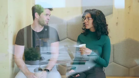 Video of two colleagues taking a break of working while talking and drinking  Stock Footage 157509795