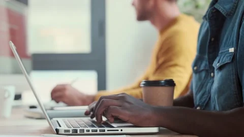 Video of two concentrated graphic designer working with computer in modern st Stock Footage 167079701