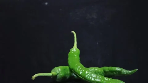 Video of two green chilies rotating in detail Stock Footage 280862068