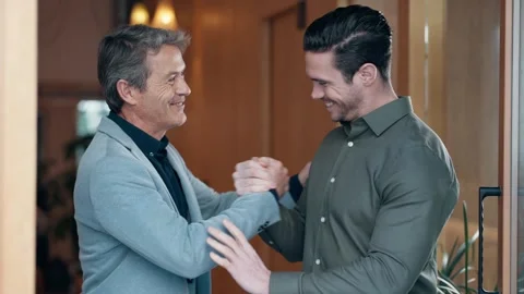 Video of two handsome men having a good time together while shaking hands i.. Stock Footage 247203828