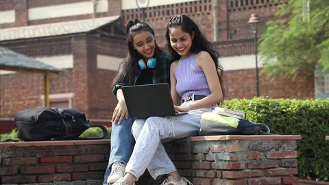 Video of two young college students studying on a college campus. Stock Footage 230016546