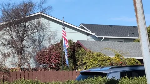 Video of U.S. flag above Seattle Seahawks banner Stock Footage 328783382