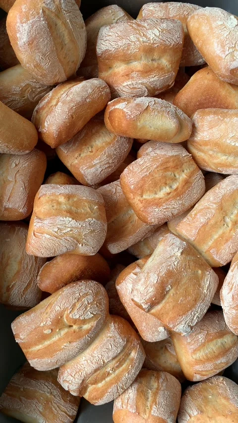 Video of various ciabatta breads in a bakery. Food and industry concept. Stock Footage 262344505