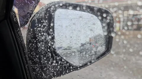 Video of view inside of the car of Side View Mirror during raining Stock Footage 140375029
