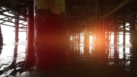 Video of walking under pier in 4K Stock Footage 78907204
