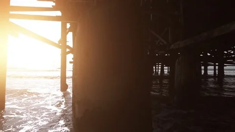 Video of walking under pier in real slow motion Stock Footage 77436198