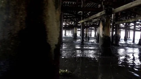 Video of walking under pier in real slow motion Stock Footage 77454559