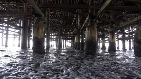 Video of walking under pier in real slow motion Stock Footage 83359792