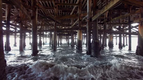 Video of walking under pier in real slow motion Stock Footage 86028397