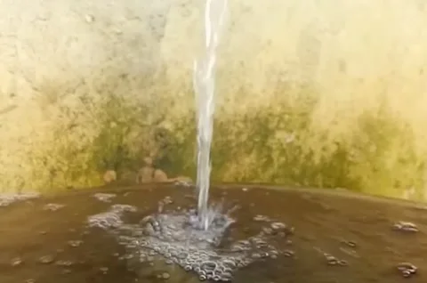 Video of water flowing from a pipe to a container Stock Footage 219329108