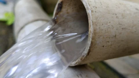 Video of Water Flowing from PVC Pipe in Close-Up View Stock Footage 305166827