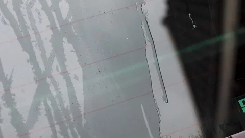 Video of water running down car window while cleaning. Stock Footage 344034901