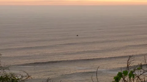 Video of the waves of the sea (Pacific Ocean in Lima, Peru) at sunset. Stock Footage 236274571
