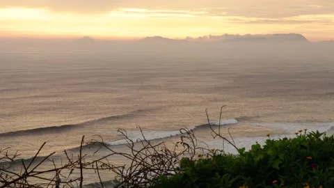 Video of the waves of the sea (Pacific Ocean in Lima, Peru) at sunset. Stock Footage 236274715