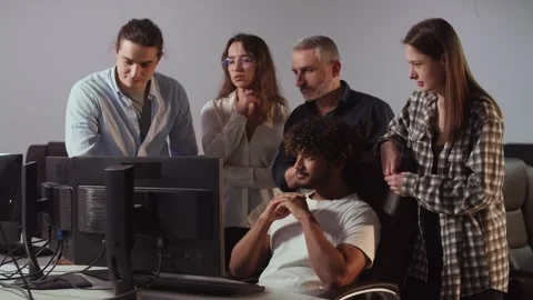 A video in which a smiling IT team congratulates their colleague on his Stock Footage 251562434