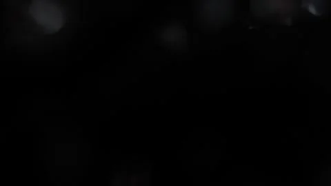 Video of a white circular pulsating bokeh glowing in the dark Видео 318061247