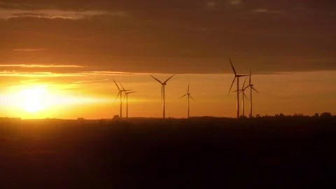 Video of windmills at the sunset in real slow motion Stock Footage 79723213