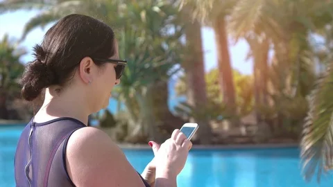 Video of woman checking her e-mails on cellphone on the vacations in 4k Stock Footage