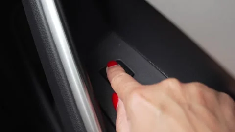 Video of a woman's hand pressing the car door lock button Stock Footage 345011684