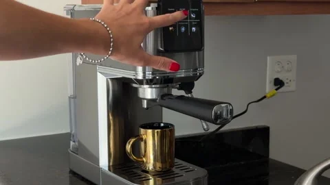 Video of a woman's hand tapping the touchscreen of a modern home coffee machine Stock Footage 342062734