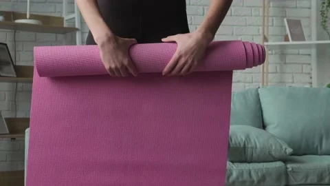 Video with woman's hands after practicing yoga rolling yoga mat. Health Stock Footage 168656769