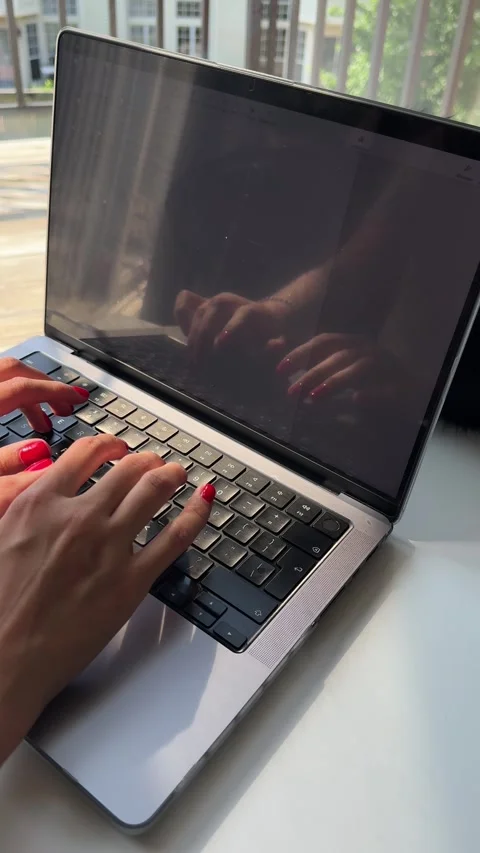 Video of a woman's hands typing on a computer keyboard Stock Footage 342062799