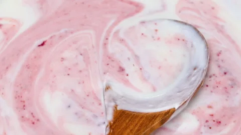 Video of yogurt with raspberry jam Stock Footage 331791378