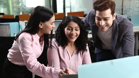 Video of young colleagues using laptop for work and looking at screen with smile Vídeo Stock 244124924