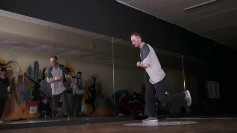 Video of young man dancing hip hop choreography and break dance. Slow motion Stock Footage 131878980