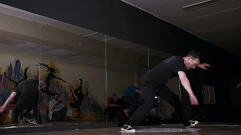 Video of young man dancing hip hop choreography and break dance. Slow motion Stock Footage 131879010