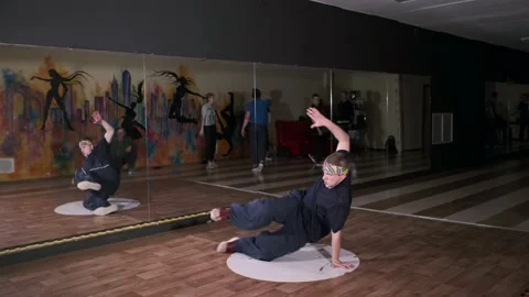 Video of young man dancing hip hop choreography and break dance. Slow motion Stock Footage 131879013