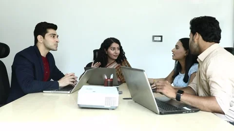 Video of Young Team Group looking at laptop while discussing about project. Stock Footage 244123826